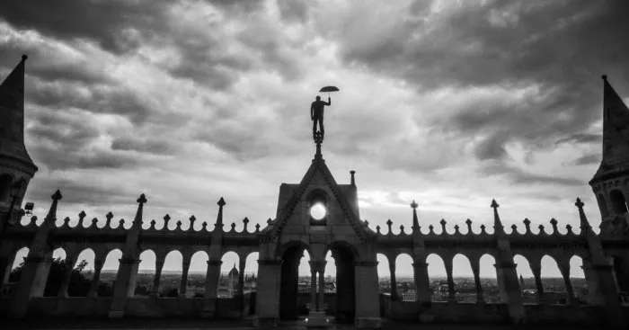 I Captured A Mysterious Umbrella Man Balancing On Budapest’s Famous Sights