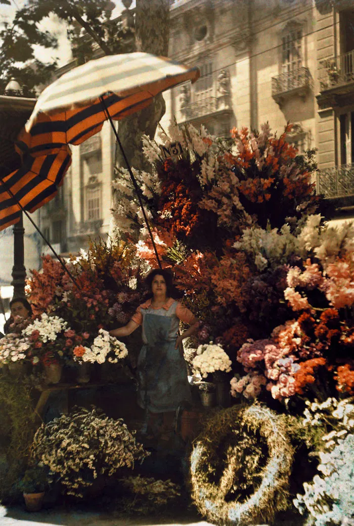 A Woman Stands In Front Of Her Flower Stand On The Rambla In Barcelona, Spain, March 1929