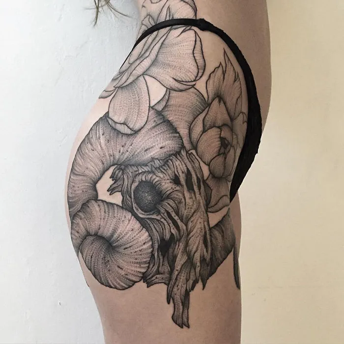 Dark and eerie creature tattoo by Russian artist, featuring intricate details on a person's hip and thigh.