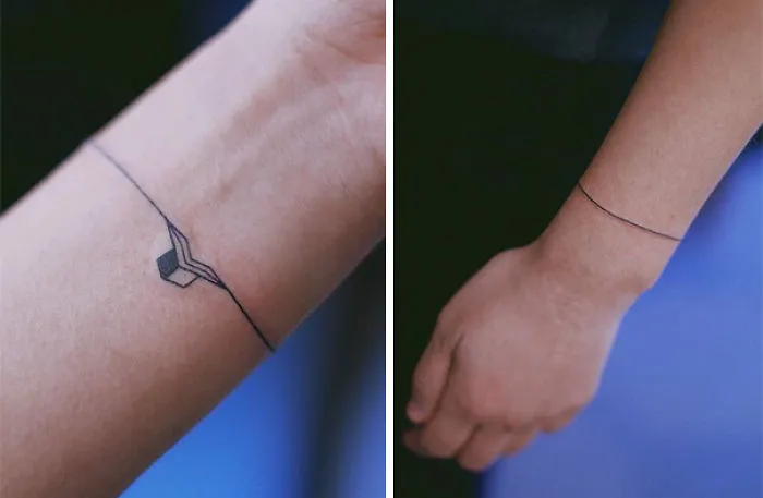 Minimalist tattoo on wrist with geometric design, showcasing simplicity and elegance.