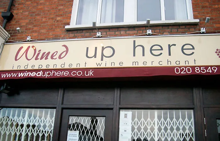 Wine shop sign ‘Wined up here’