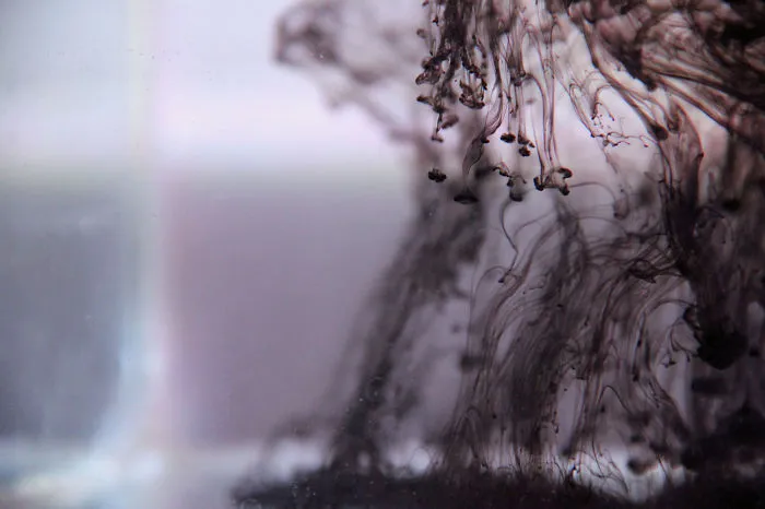 Ink In Glass Tank Filled With Water