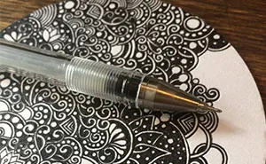 I Create Intricate Pen Drawings On Coasters With Floral Motives