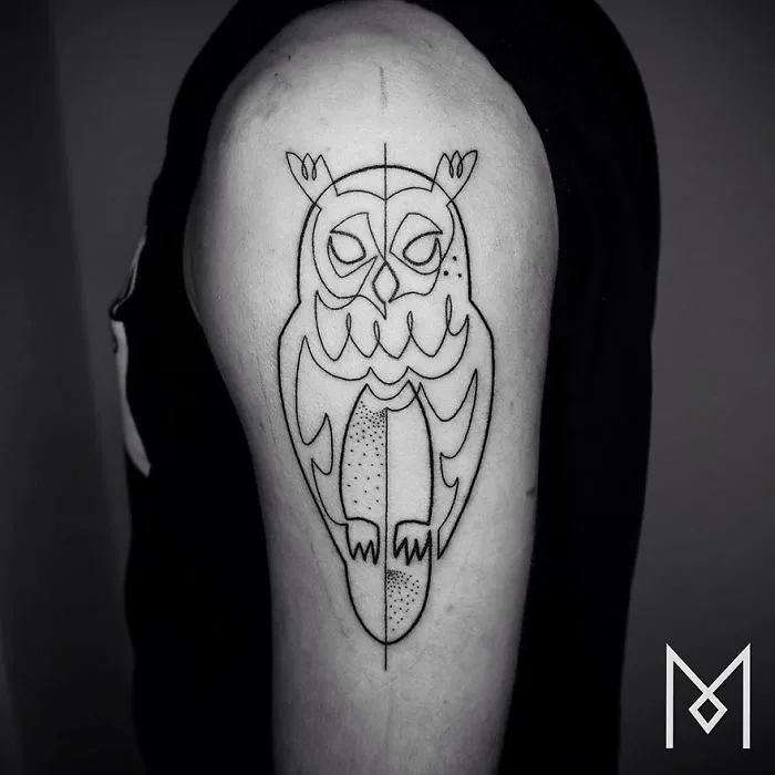 Minimalist single line tattoo of an owl on a person's upper arm, created by an Iranian-German artist.