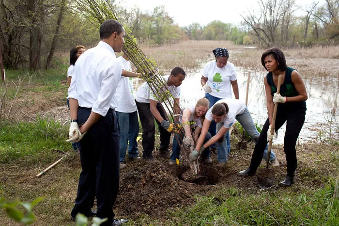 President Barack Obama And First Lady Michelle Obama Participate In Tree Plantings At The Kenilworth Aquatic Gardens In Washington