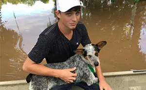 Dad And Son Rescued 30 Dogs Left Behind During The Flood