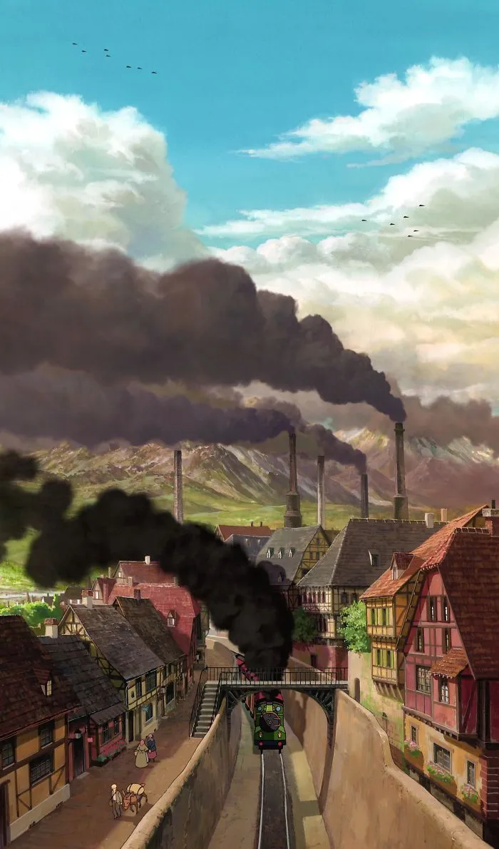 Studio Ghibli wallpaper with a vintage train passing through a town, emitting black smoke under a cloudy sky.