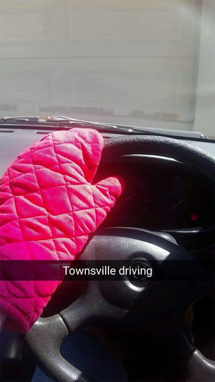 Oven mitt on a steering wheel with "Townsville driving" caption. Hilarious Snapchat moment.