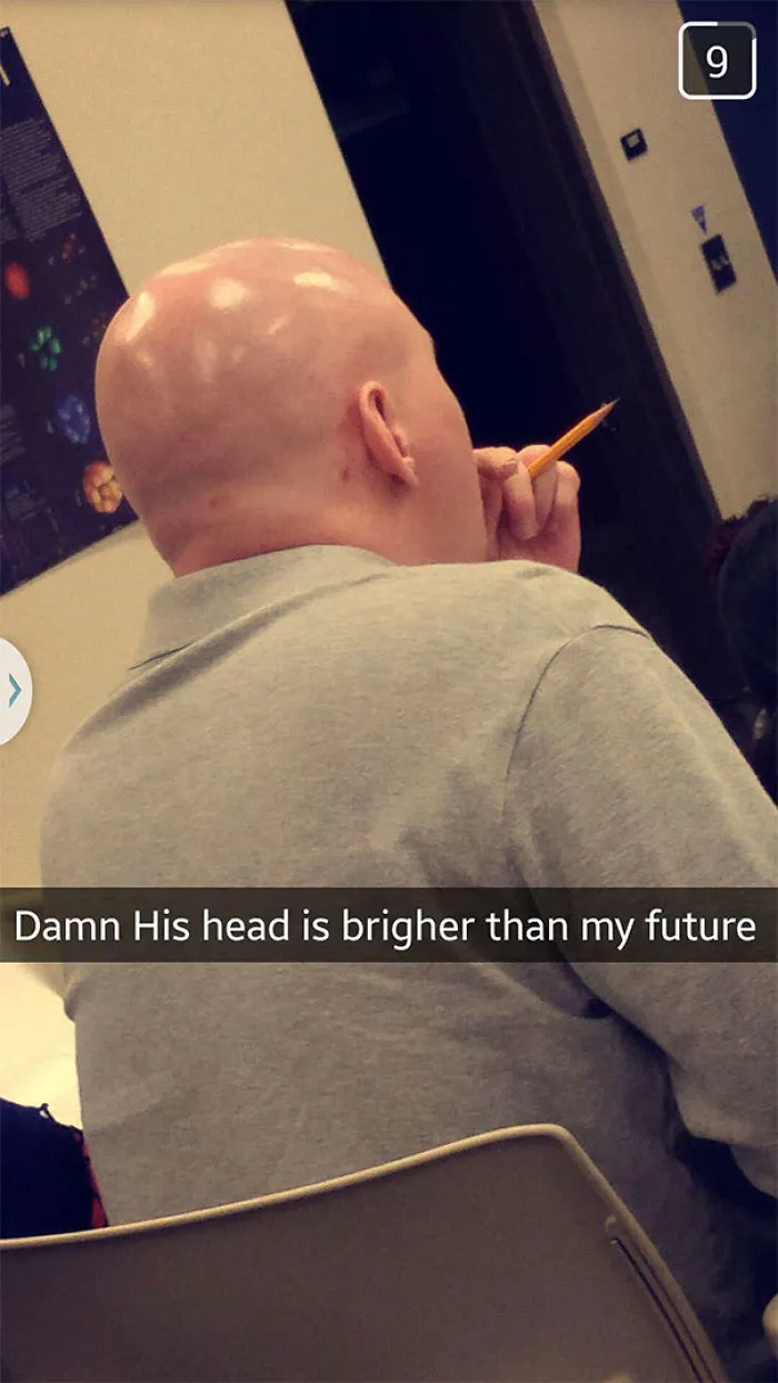 Bald man in class with caption: "His head is brighter than my future," capturing a hilarious Snapchat moment.