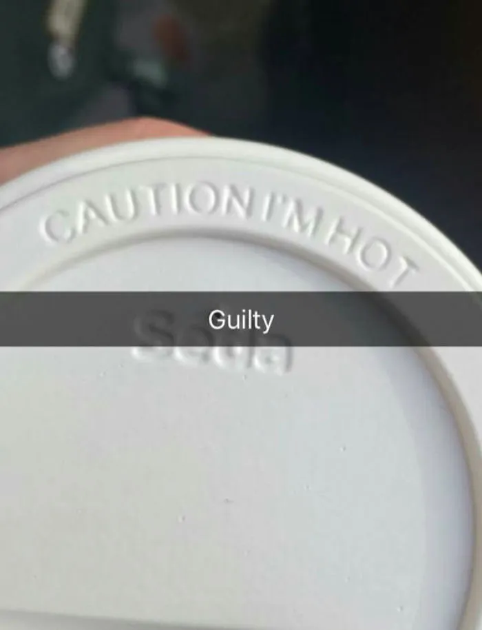 A coffee cup lid with "Caution I'm Hot" and "Guilty" text overlay; a hilarious Snapchat moment captured.