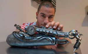Tattoo Artist Who Lost His Arm Gets World's First Tattoo Machine Prosthesis