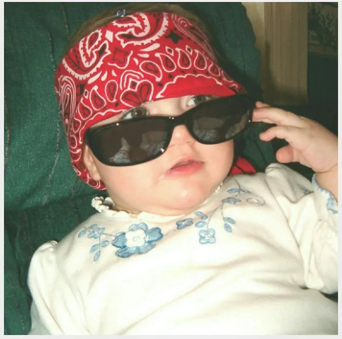 Baby with red bandana and sunglasses looking cool