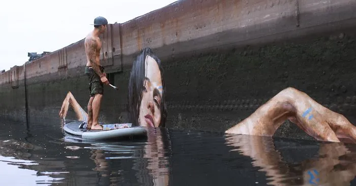 Artist Paints NEW Stunning Seaside Murals While Balancing On A Paddleboard
