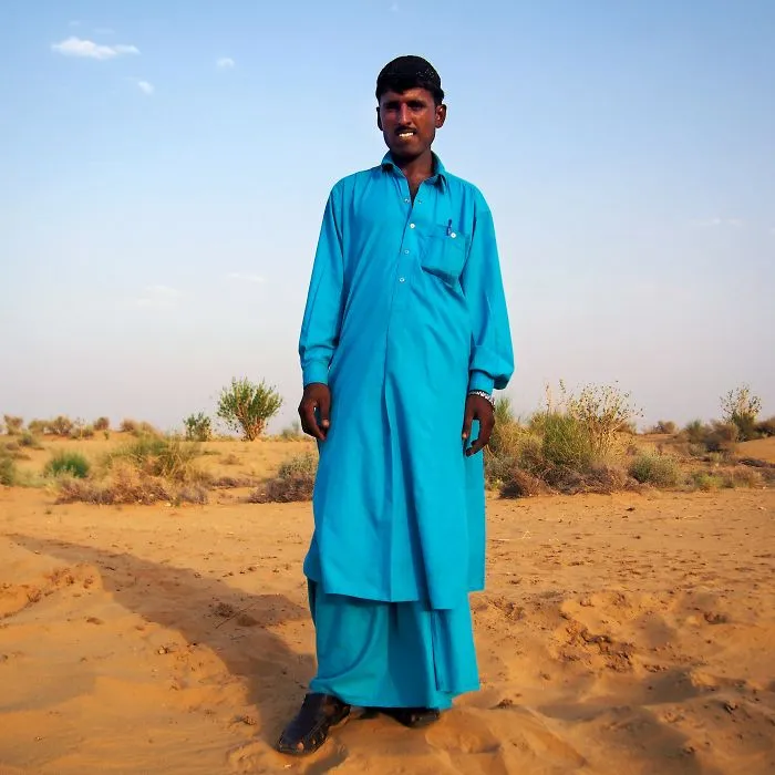Khan, Camel Safari Guide In The Thar Desert. Jaisalmer, Rajasthan, India