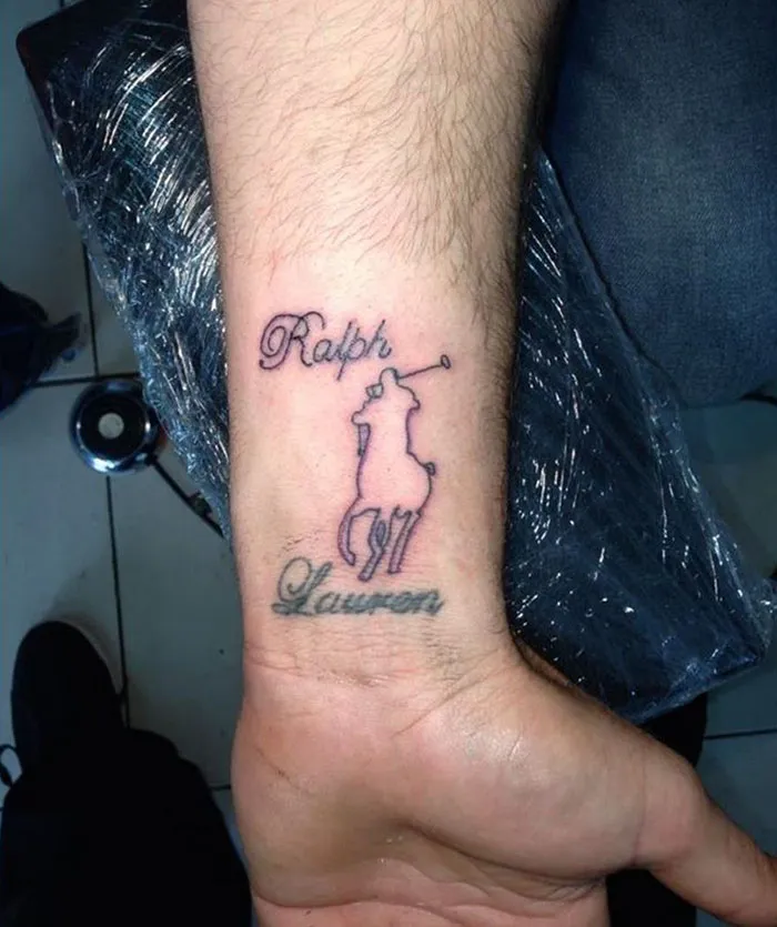 Arm displaying a creative cover-up tattoo with a stylized horse and rider logo.