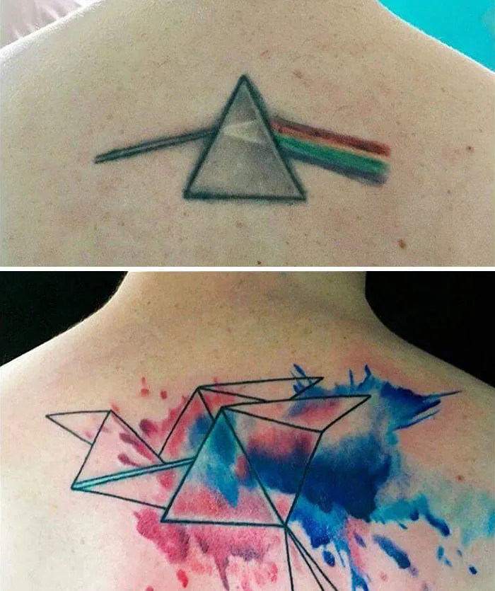 Geometric cover-up tattoo with colorful abstract splashes over an old triangle design.