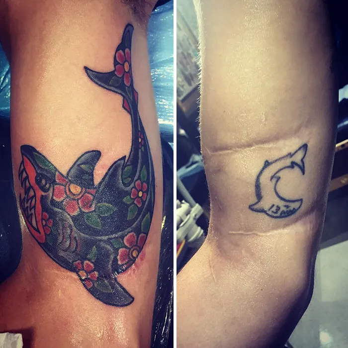 Creative cover-up tattoo of a vibrant shark with floral patterns over a faded small shark tattoo.