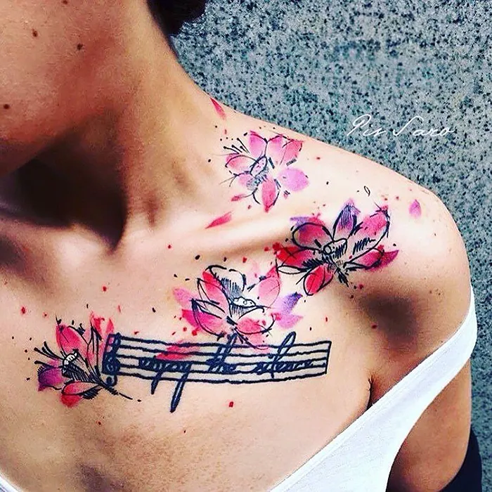Floral tattoos on shoulder and chest inspired by nature and seasons.
