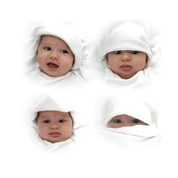 Grid of four babies with white hats showing varied expressions