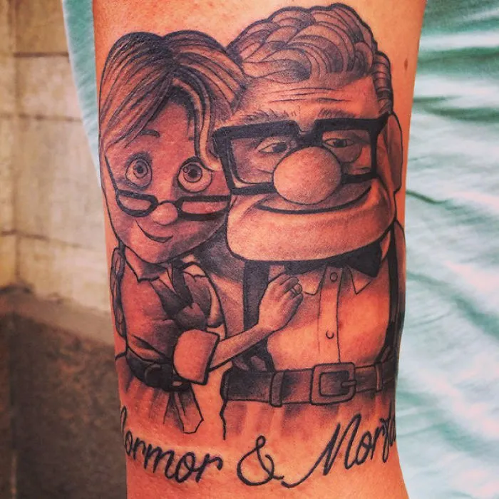 Pixar-inspired tattoo featuring an elderly couple from a beloved animated film.