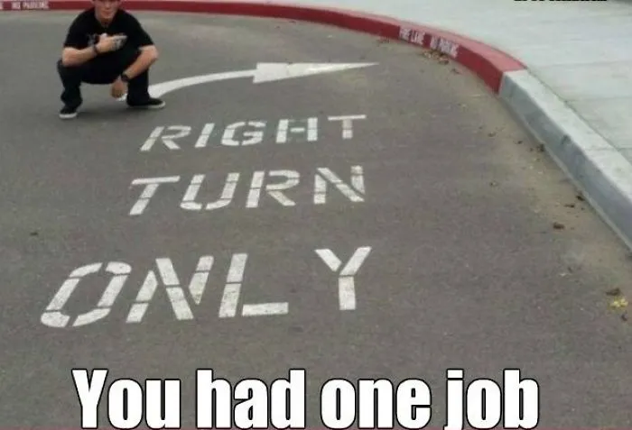 Sign on the road says "Right Turn Only" with an arrow pointing left, highlighting a failed task.