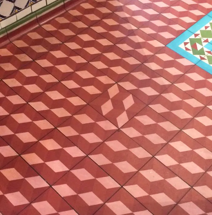 Patterned floor tiles misaligned; visual example of a failed job execution.