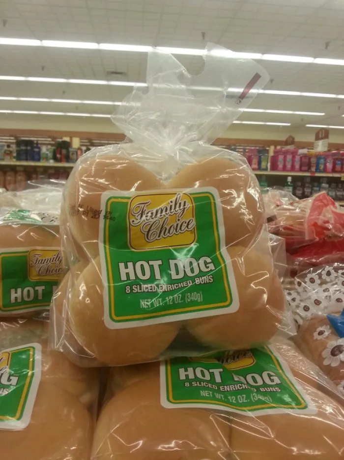 A mislabeled pack of hamburger buns as "hot dog" in a grocery store aisle.