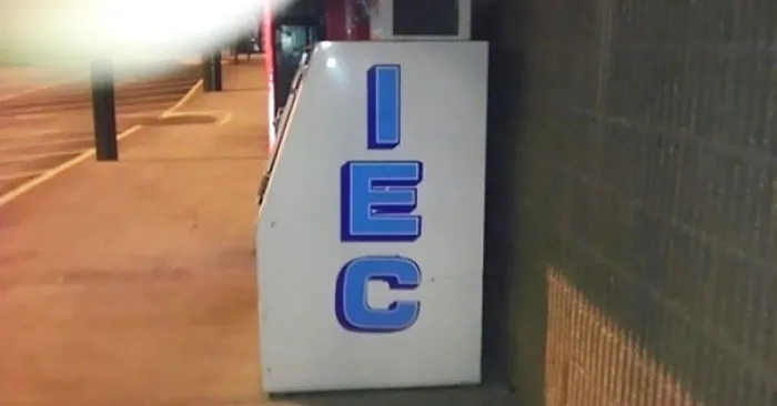 Ice machine with letters vertically misaligned, spelling "IEC," illustrating a job fail.