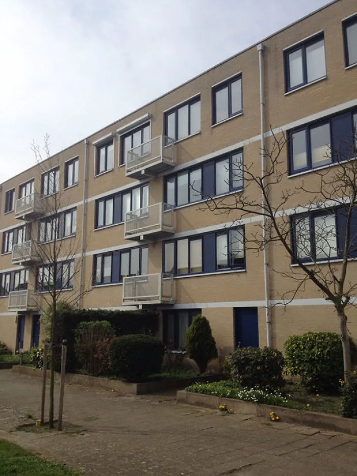 Apartment building with misplaced balconies, illustrating a notable job failure.
