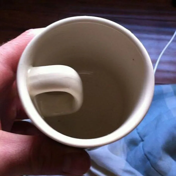 Cup with handle installed inside, illustrating a job fail.