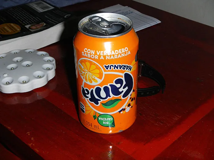 Fanta can with upside-down label on a table, illustrating a typical fail.