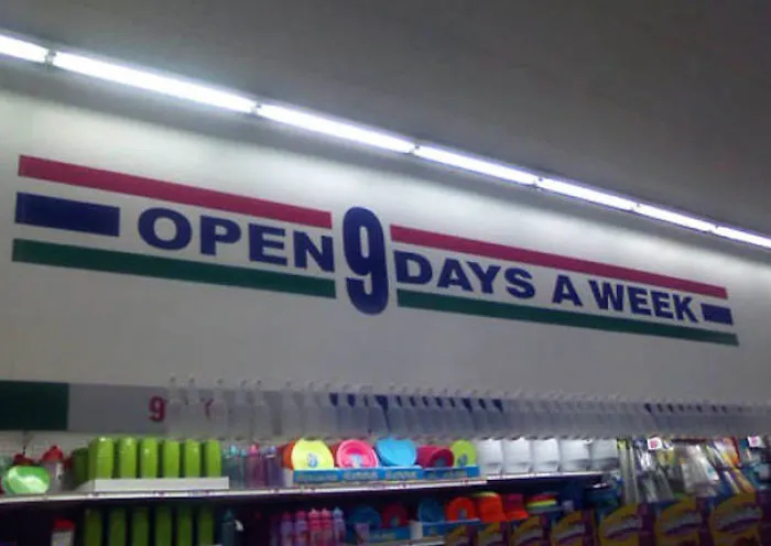 Store sign error reading "Open 9 Days a Week" above a retail display, highlighting a humorous job fail.
