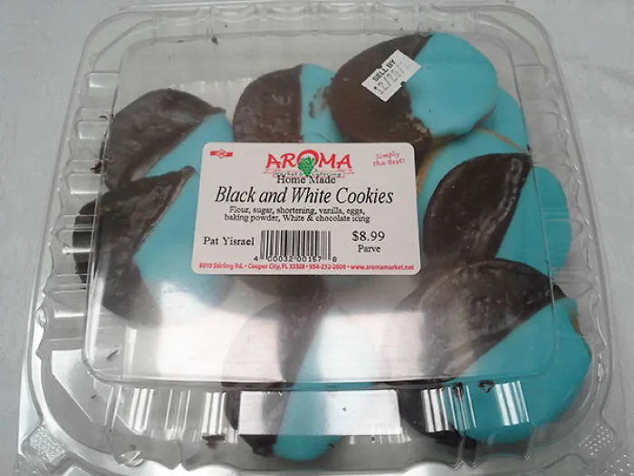 Packaging labeled "Black and White Cookies" with cookies visibly blue and black.