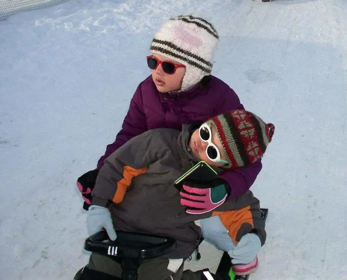 Napping On The Sleigh With Older Sister...
