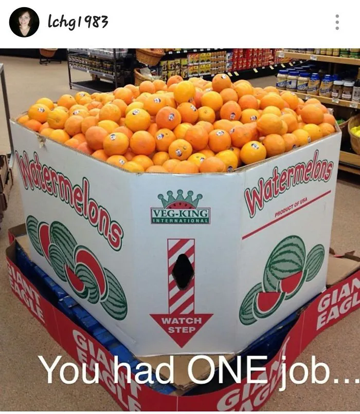 Oranges placed in a box labeled watermelons, showcasing a funny one job fail.