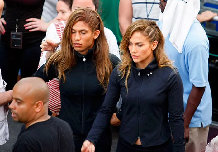 Two women with braided hair wearing black jackets, representing Hollywood celebrities’ body doubles on set.