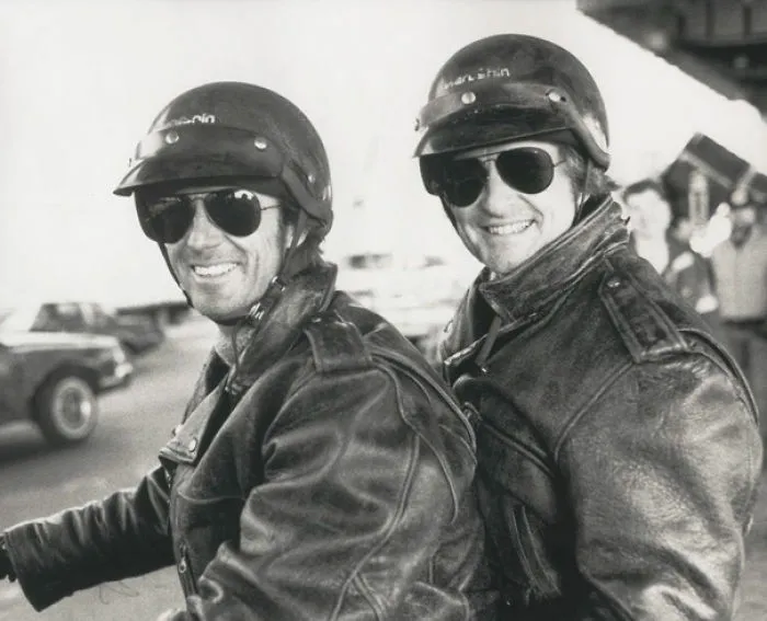 Black and white photo of two men in helmets and leather jackets, showcasing Hollywood celebrities’ body doubles.