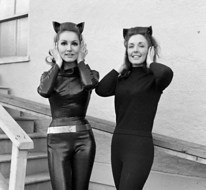 Two women in black costumes with cat ears posing, illustrating Hollywood celebrities’ body doubles in classic style.