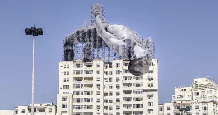 French Artist JR Installs Giant Athletes Across Rio's Urban Landscape For 2016 Olympic Games