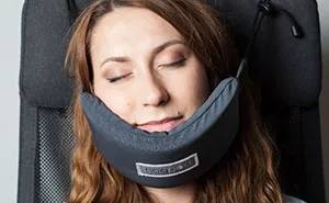 Someone Finally Invented A Head Hammock So You Could Fall Asleep On A Plane