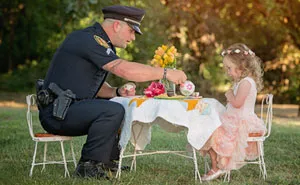 This 2-Year-Old Girl Threw A Tea Party For A Cop Who Saved Her Life