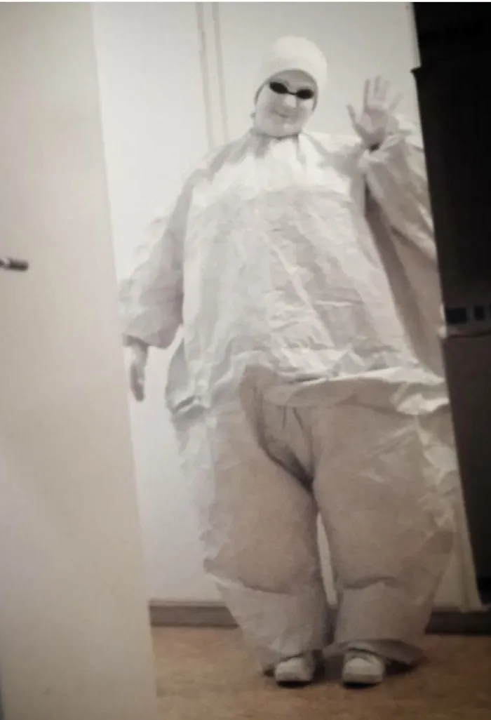 A person wearing a white full-body suit for creative Halloween costume ideas