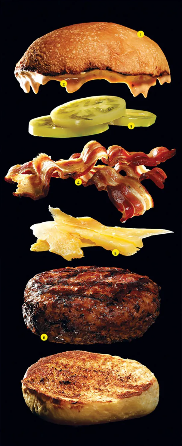 Deconstructed burger layers on black backdrop showcasing photography illusions.