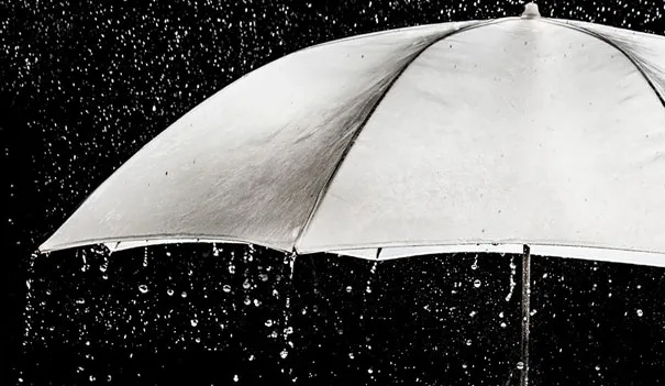White umbrella in rain, demonstrating how photography can create illusions.