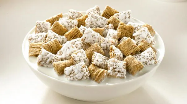 Bowl of cereal pieces floating in milk, showcasing how photography can be a creative illusion.