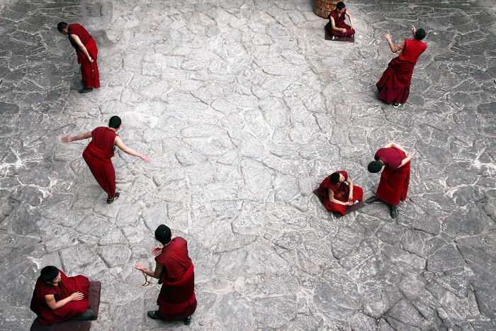 Monks Debate Doctrines Every Afternoon At The Jokhang Temple In Lhasa, Tibet