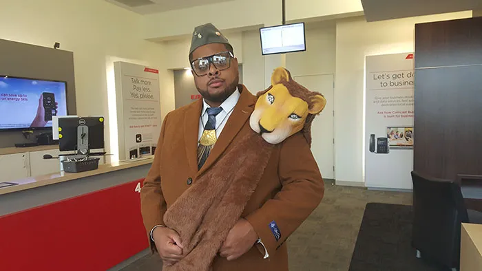 A man wearing a plush lion scarf as a creative Halloween costume idea.