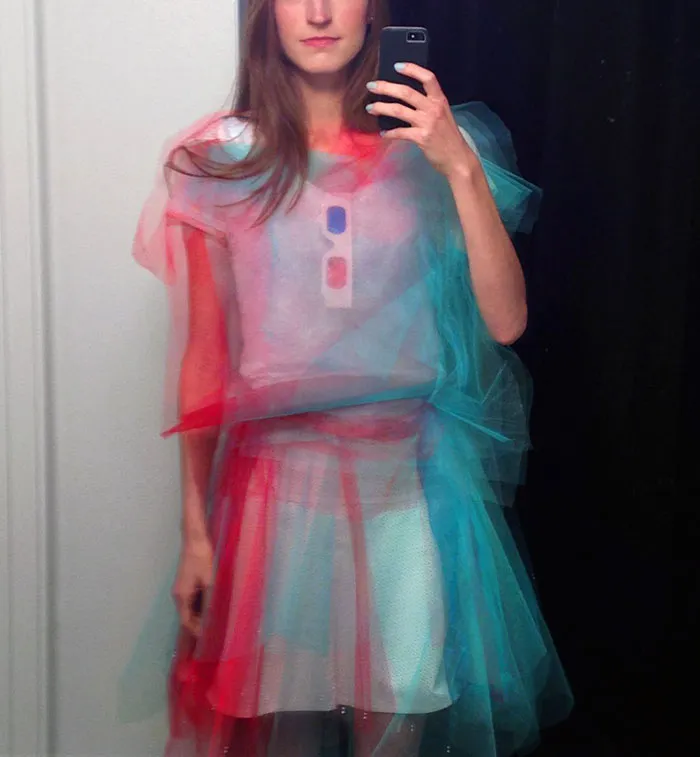 Woman posing in a red and blue layered 3D tulle dress for creative Halloween costume ideas