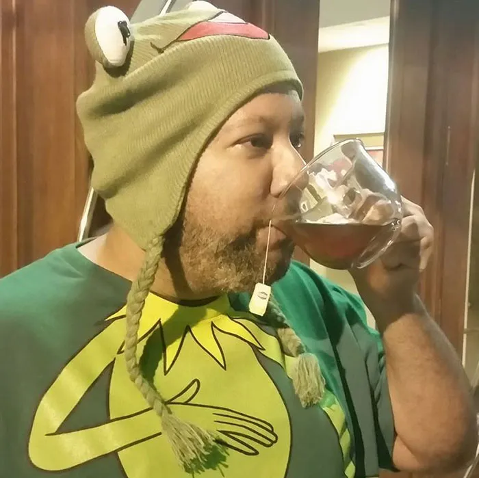 Man dressed as the Kermit sipping tea meme as a creative Halloween costume idea