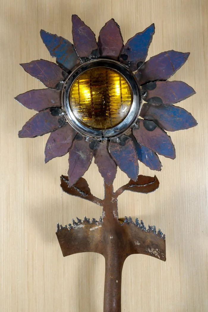 I Also Cut Shovels. The Blue And Lavender Peddles On This Fog Light Flower Is Made From The Scrap Metal Of A Dumpster